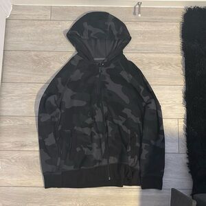black and gray camo zip up jacket in good condition only slightly used
